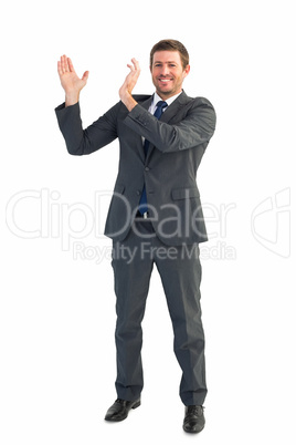 Happy businessman with hands up