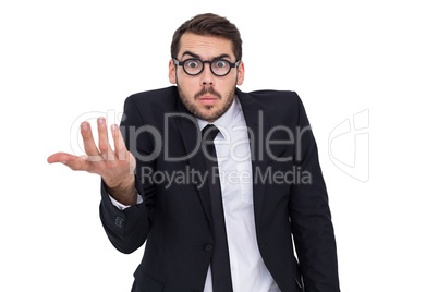 Doubtful businessman with glasses gesturing