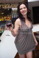 Pretty brunette enjoying red wine