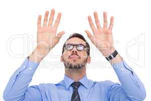Businessman with arms raised and his fingers spread out