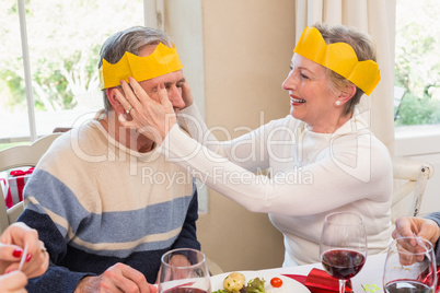 Smiling mature couple in party hat