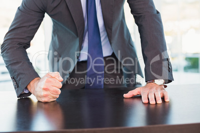 Angry businessman thump the table