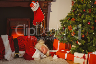 Santa claus napping on the rug