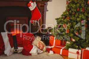 Santa claus napping on the rug