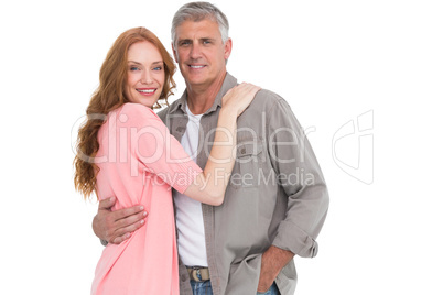 Casual couple hugging and smiling