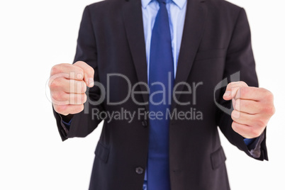 Businessman with clenched fist in front of him
