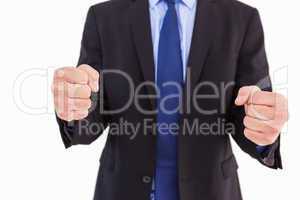 Businessman with clenched fist in front of him