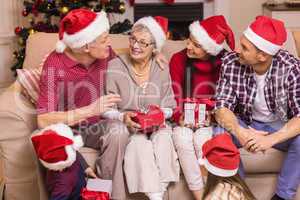 Festive family speaking together at christmas