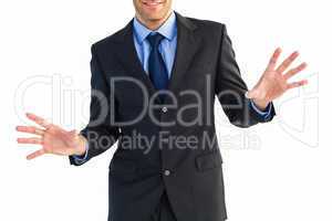 Businessman standing with fingers spread out