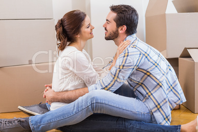 Cute couple sitting on the floor