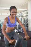 Fit woman working out on the exercise bike