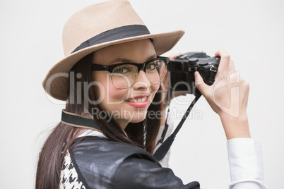 Pretty hipster taking a photo