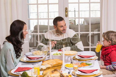 Mother father and son during christmas dinner