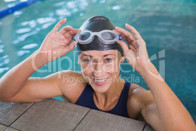 Close up portrait of female swimmer in pool at leisure center