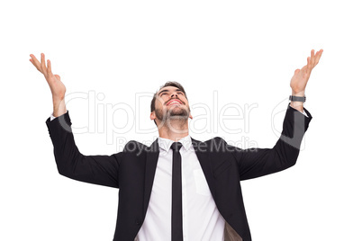 Businessman cheering with hands raised