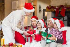 Grandmother giving gift to her family