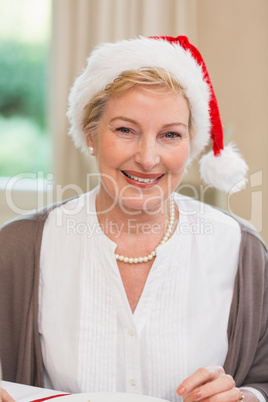 Portrait of a pretty mature woman in santa hat