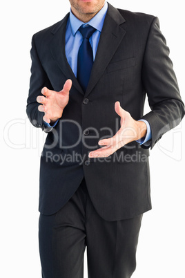Mid section of a businessman presenting with his hands