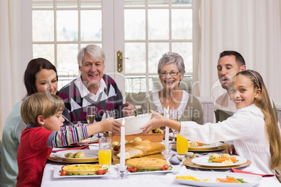 Smiling extended family at the christmas dinner table