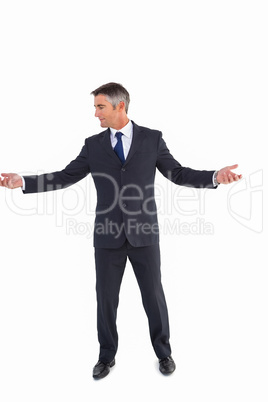 Businessman well dressed spreading his arms