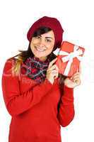 Brunette in red hat holding a gift
