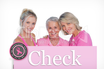 Composite image of happy women wearing pink tops and ribbons for