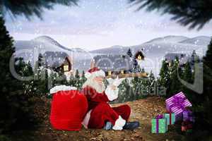 Composite image of santa looking through telescope