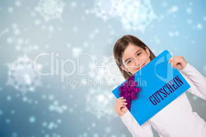 Composite image of cute little girl showing card