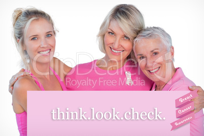 Composite image of women wearing pink tops and ribbons for breas