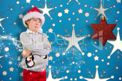 Composite image of festive boy sulking