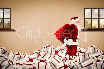 Composite image of santa walking on pile of gifts