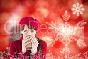 Composite image of woman drinking from a cup