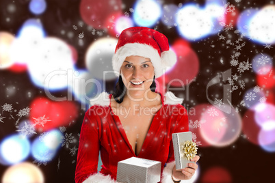 Composite image of smiling woman opening christmas present