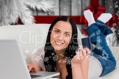 Composite image of woman ordering shopping from online