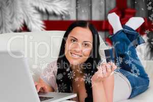 Composite image of woman ordering shopping from online
