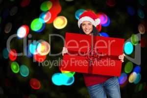 Composite image of woman holding a sign