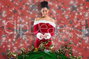 Composite image of pretty santa girl presenting with hands