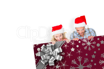 Composite image of young festive couple