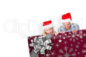 Composite image of young festive couple