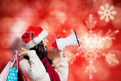 Composite image of woman holding some shopping bags