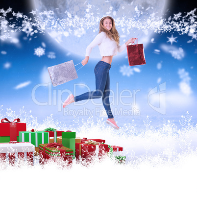 Composite image of pretty blonde with shopping bags