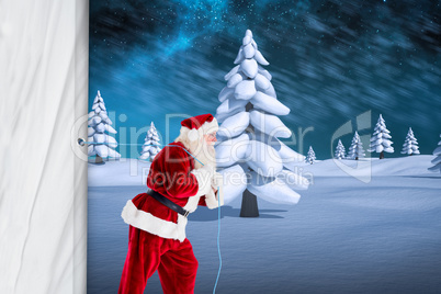 Composite image of santa claus pulling rope