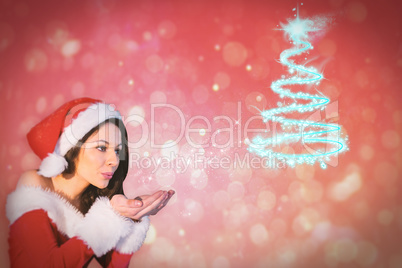 Composite image of pretty girl in santa outfit blowing