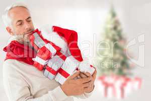 Composite image of happy festive man with gifts