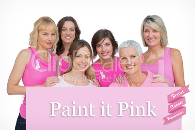 Composite image of happy women posing and wearing pink for breas