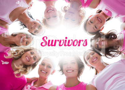 Group of happy women in circle wearing pink for breast cancer