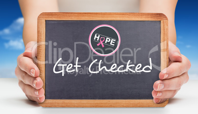 Composite image of females hands showing black board