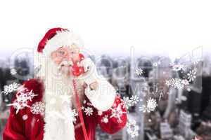 Composite image of santa claus on the phone