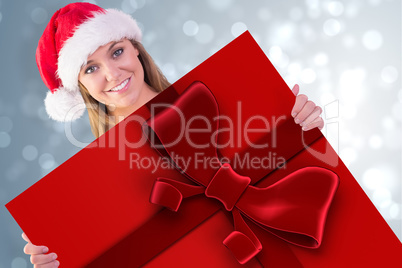 Composite image of festive blonde smiling at camera