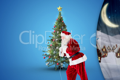 Composite image of santa claus pulling rope